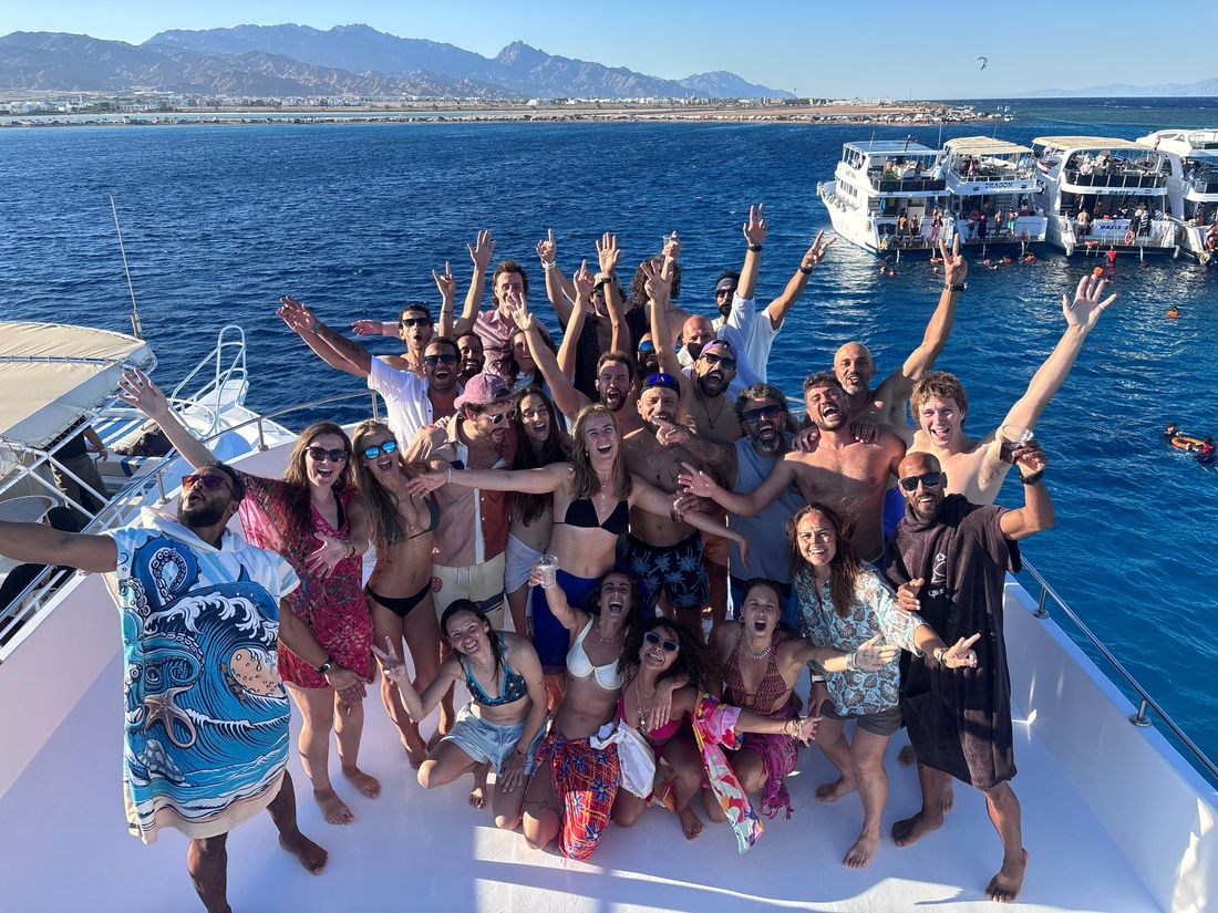 The whole group celebrating on the boat