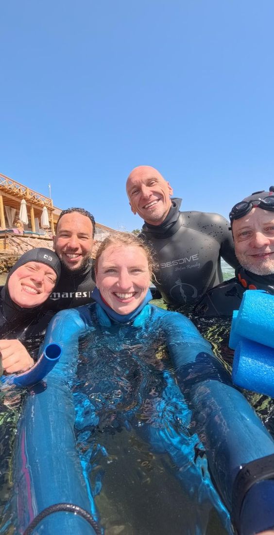 A group selfie of smiles after a session
