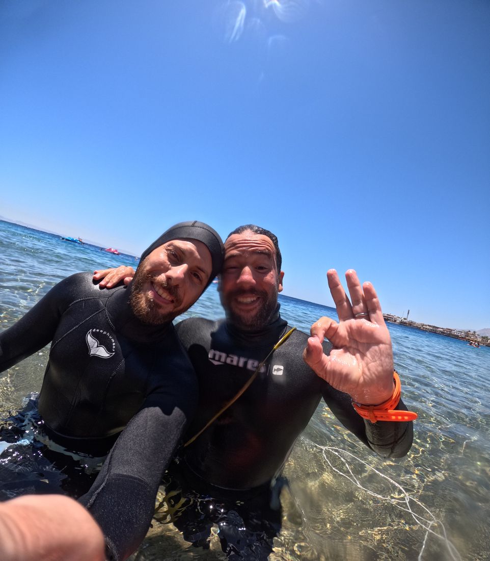 Two freedivers celebrating after a dive, Dahab