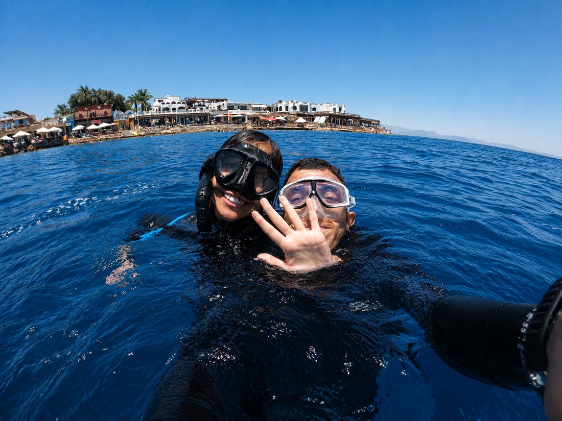 Students at the buoy with the Dahab shore behind