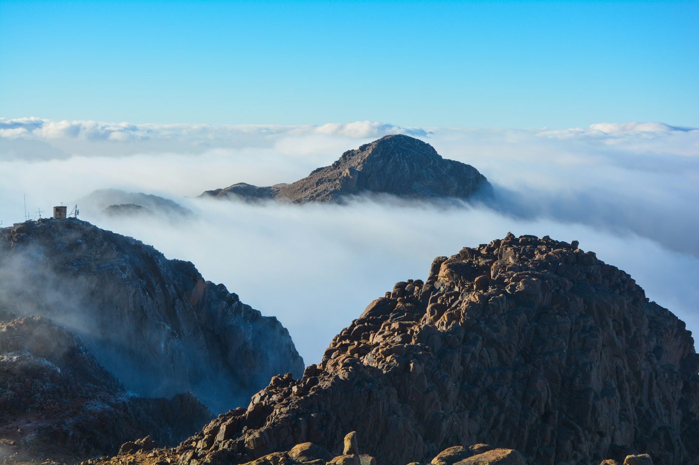 The peaks of Mount Moses rising above the clouds at dawn, Sinai
