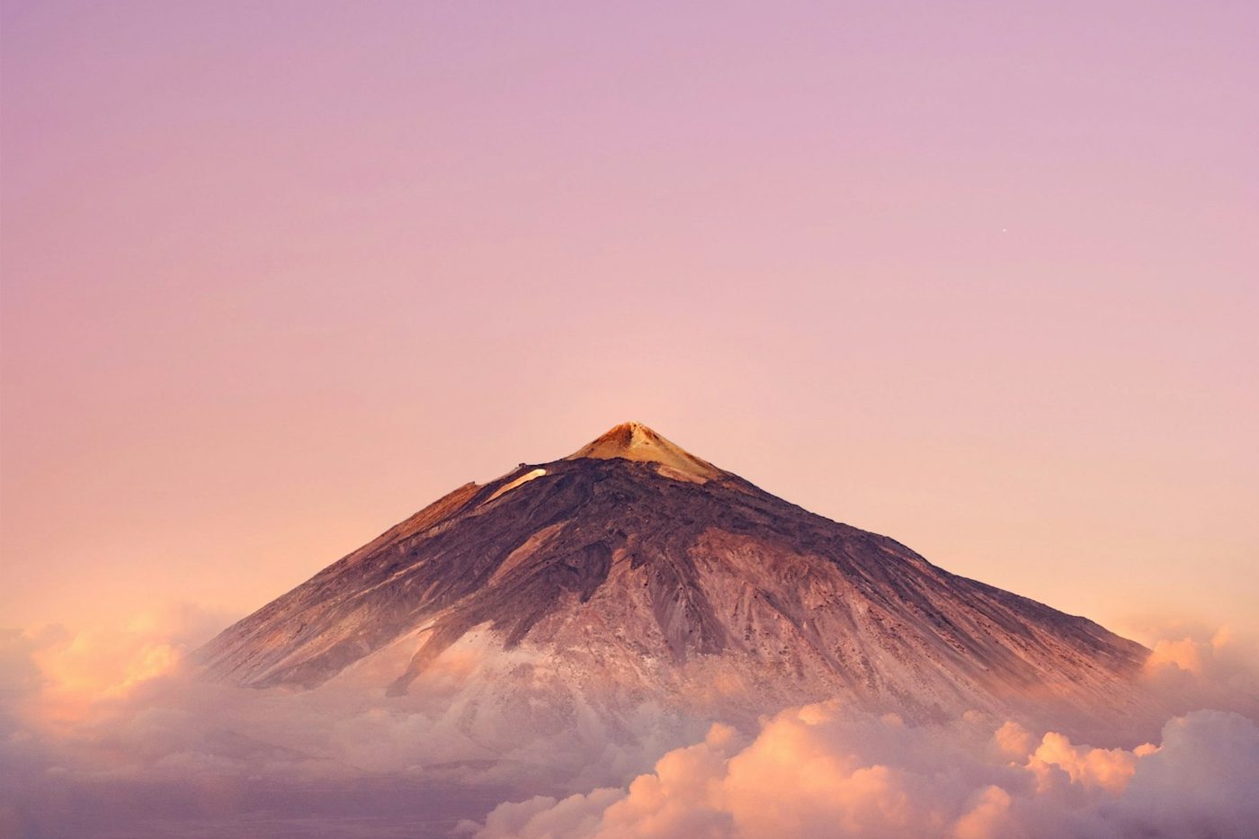 The peak of Mount Teide above the clouds at sunrise, Tenerife